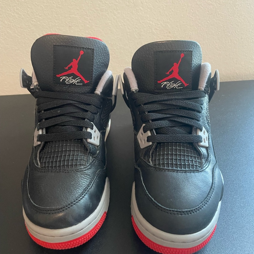 Black and Red Sneakers with Iconic Logo